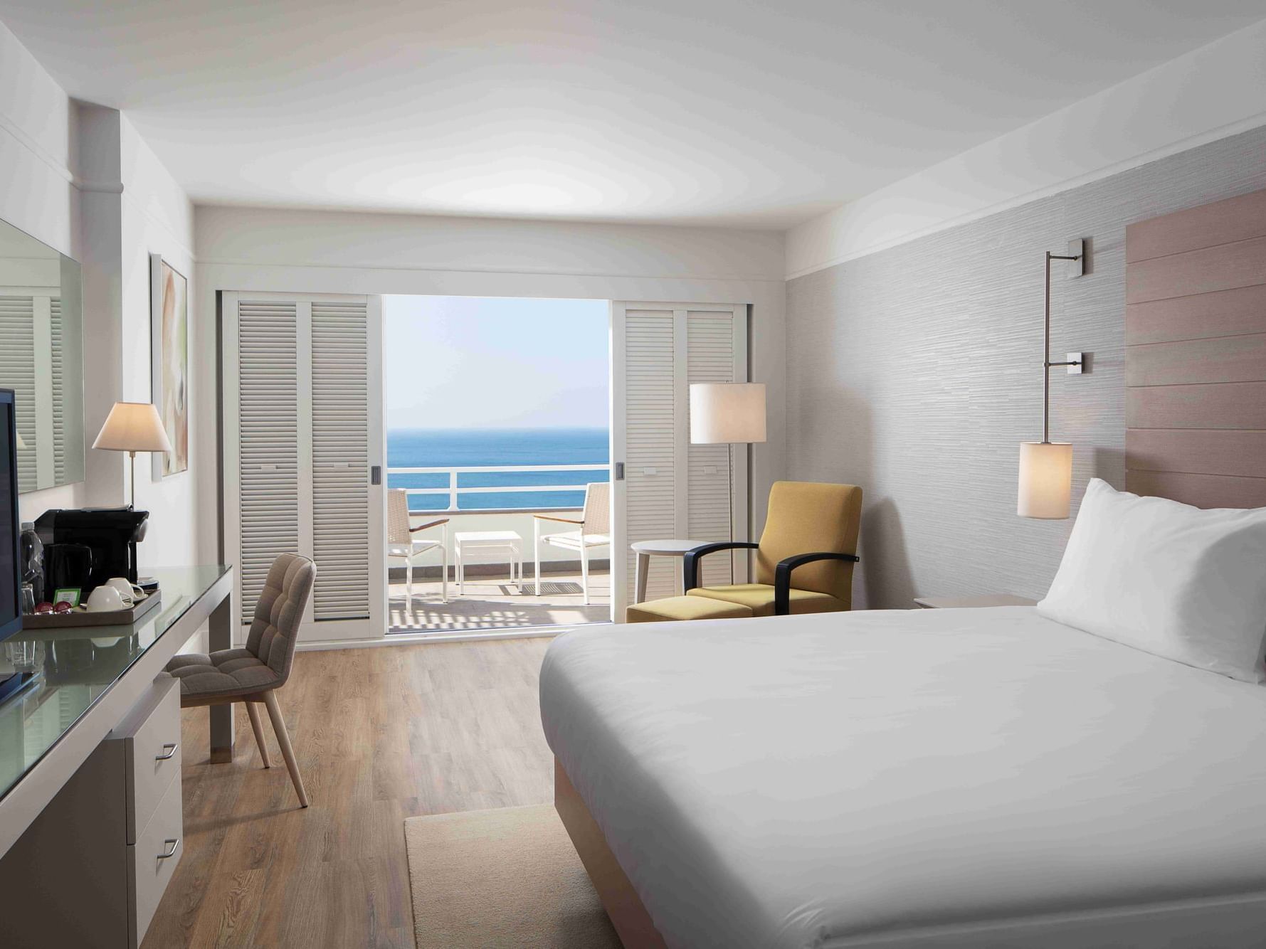 Bed & lounger with sea view in Deluxe Room, Doria Hotel Bodrum