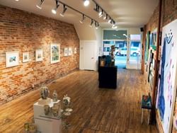 Art gallery with rustic brick walls in Artspace near Retro Suites Hotel