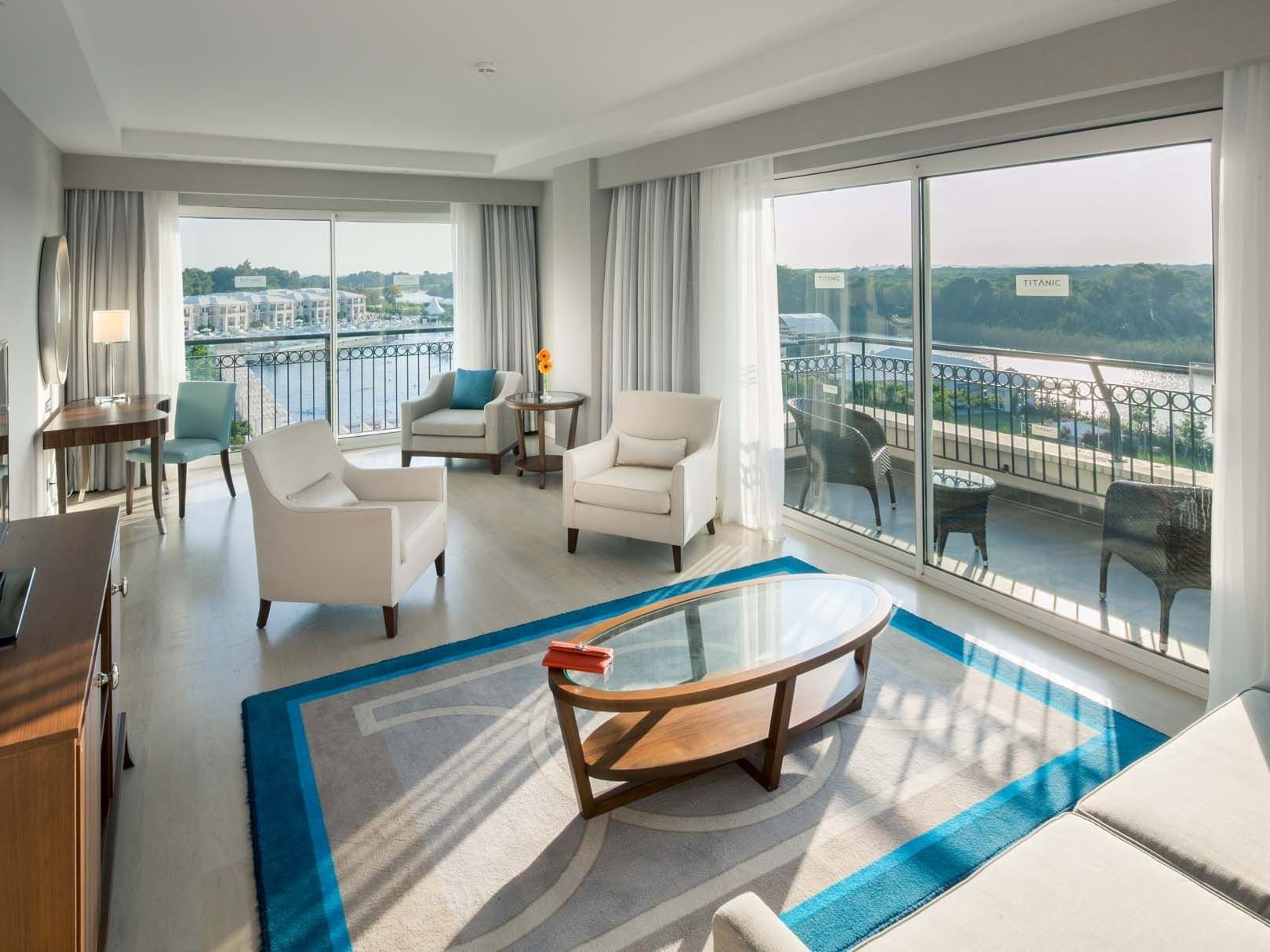 TV lounge area with wooden floors in Major Suite at Titanic Deluxe Golf Belek