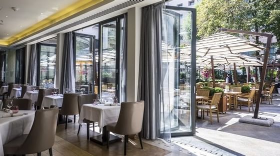 Indoor & outdoor dining area in a Restaurant at Ana Hotels