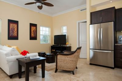 Refrigerator and TV lobby area in Island suites at Windsong Resort On The Reef