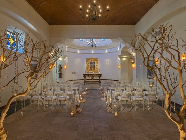 Chapel indoor wedding ceremony space at Hacienda del Mar Los Cabos with chairs and a path of candles
