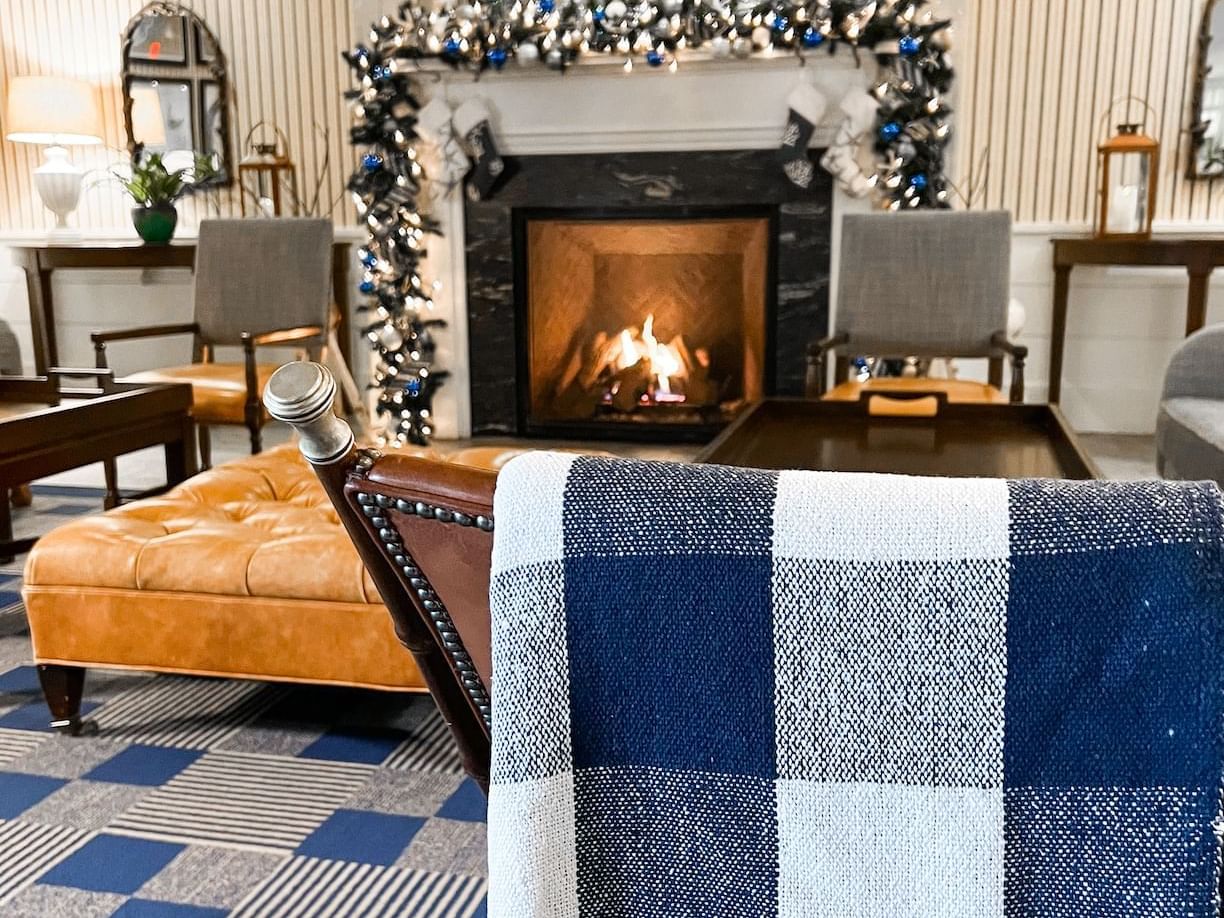 Sofa with fire place in lobby area at Beauport Hotel Gloucester