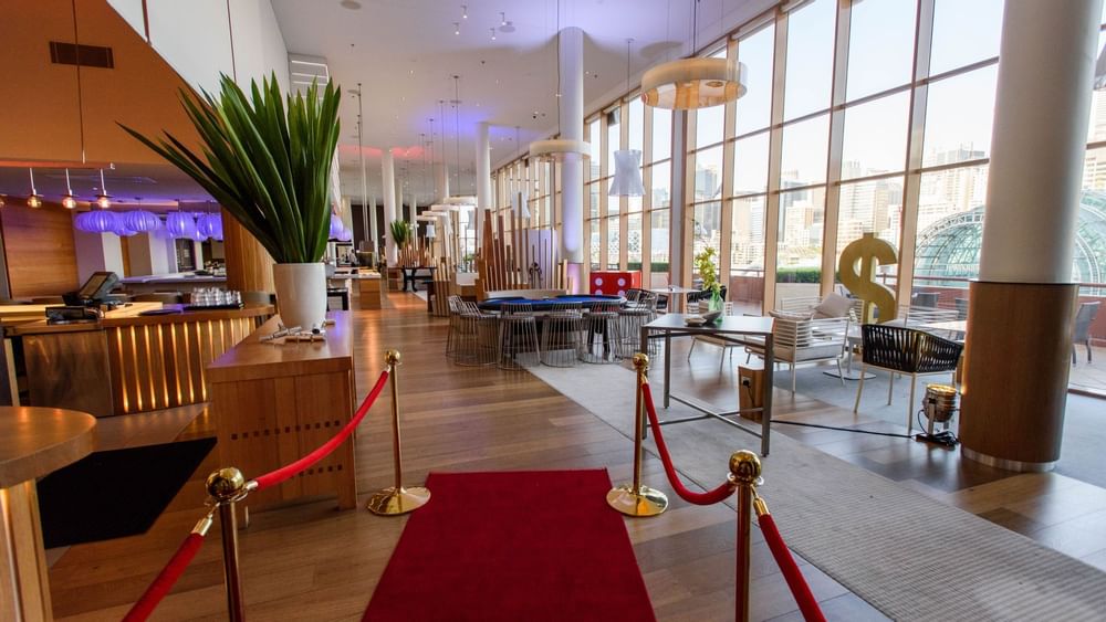 Lounge area with a red carpet and city views in Events by The Ternary at Novotel Sydney on Darling Harbour