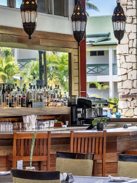 Poolside Bar featuring a wide selection of spirits and a professional espresso machine at TokaToka Resort Nadi Fiji