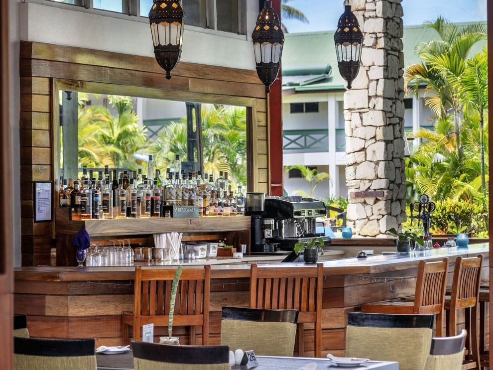 Poolside Bar featuring a wide selection of spirits and a professional espresso machine at TokaToka Resort Nadi Fiji
