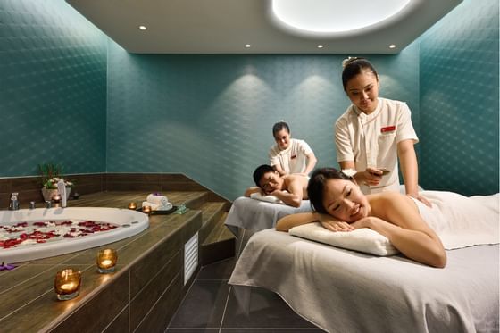 Couples enjoying spa massage session - Lexis Hibiscus