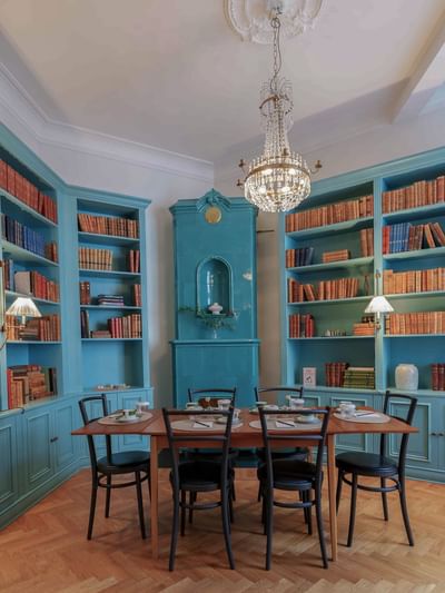 Table by the bookshelves in La Bibliothèque at The Sparrow Hotel