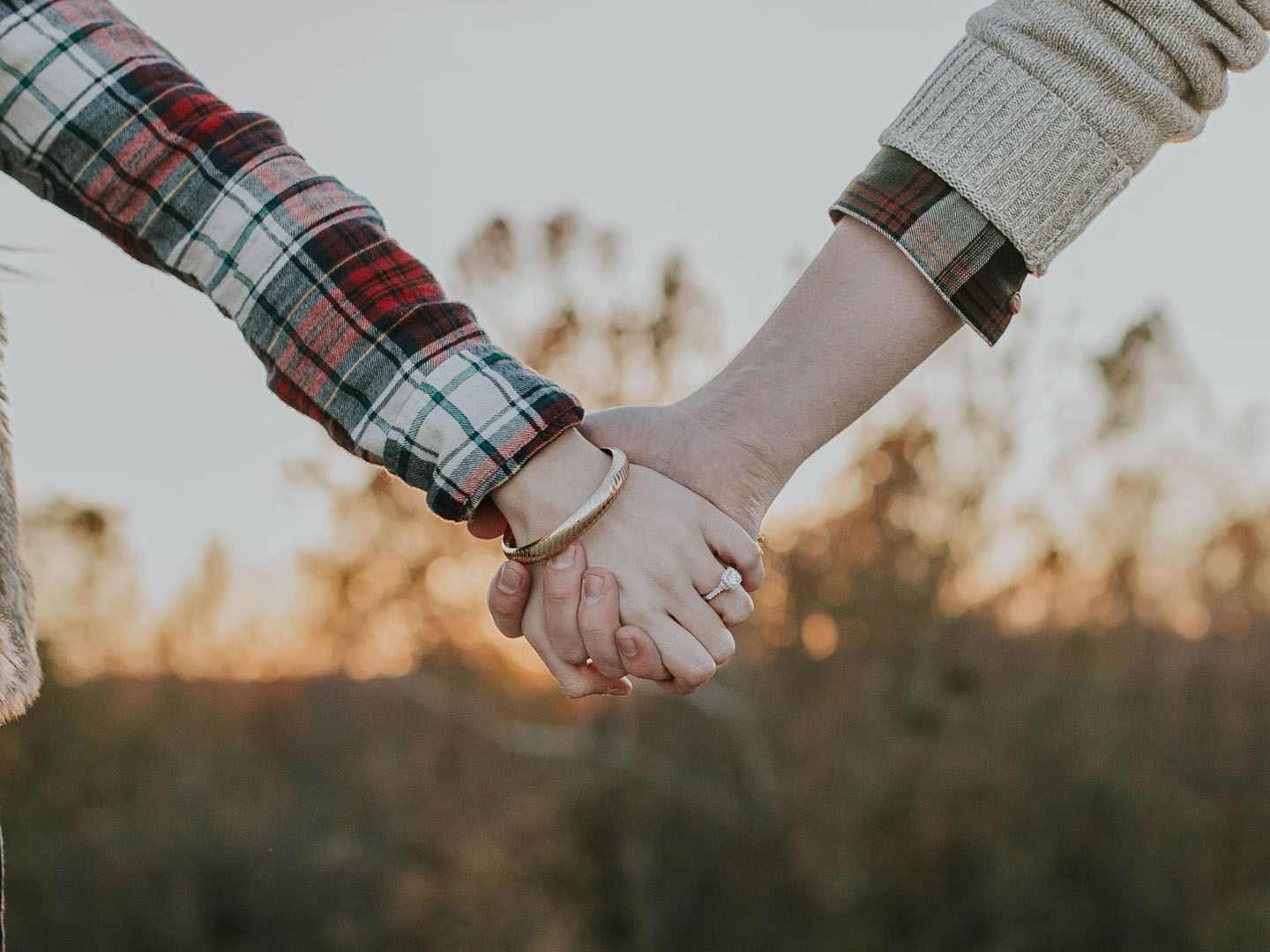 Close-up of a couple holding hands at Music Road Resort
