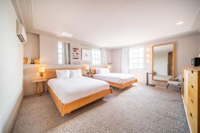 2 Comfy beds & mirror in Double Queen room at Hotel Weyanoke