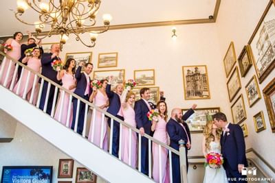Wedding party on a stairway at Horton Grand Hotel