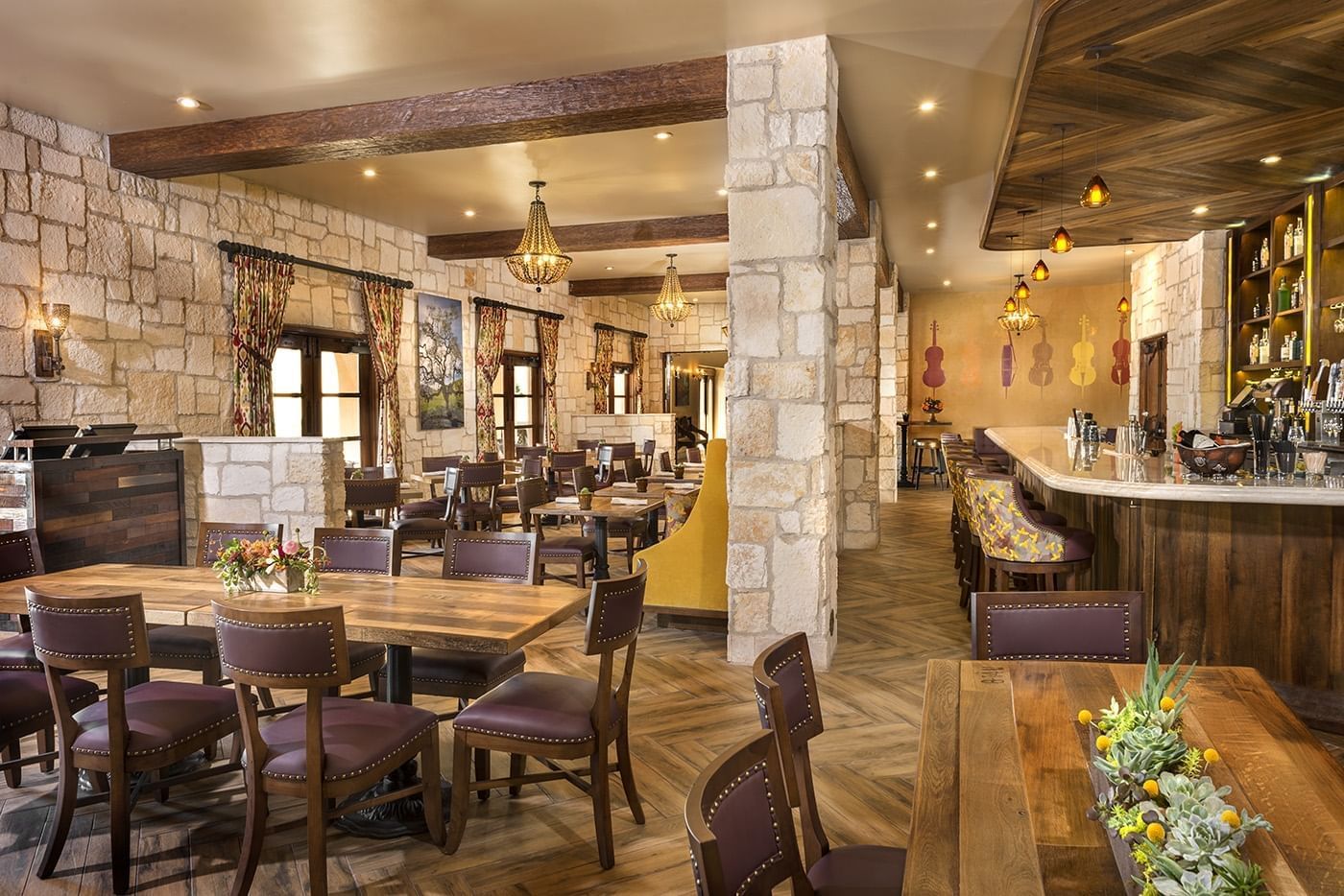 Looking through the Cello Restaurant with stone walls and wood b