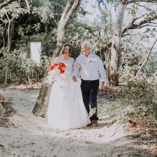 Wedding couple walking at Pullman Palm Cove Sea Temple Resort