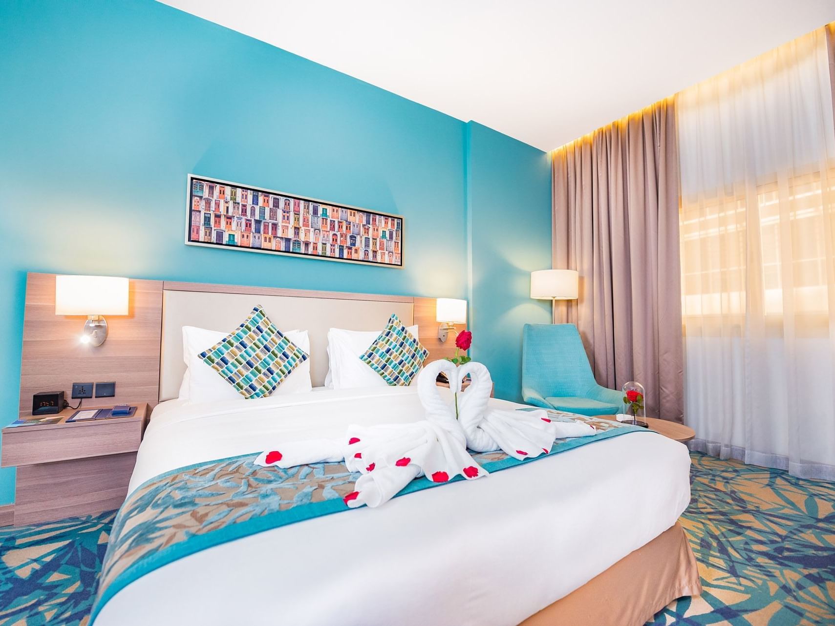 King size bed in Deluxe king Suite at Mena Plaza Hotel