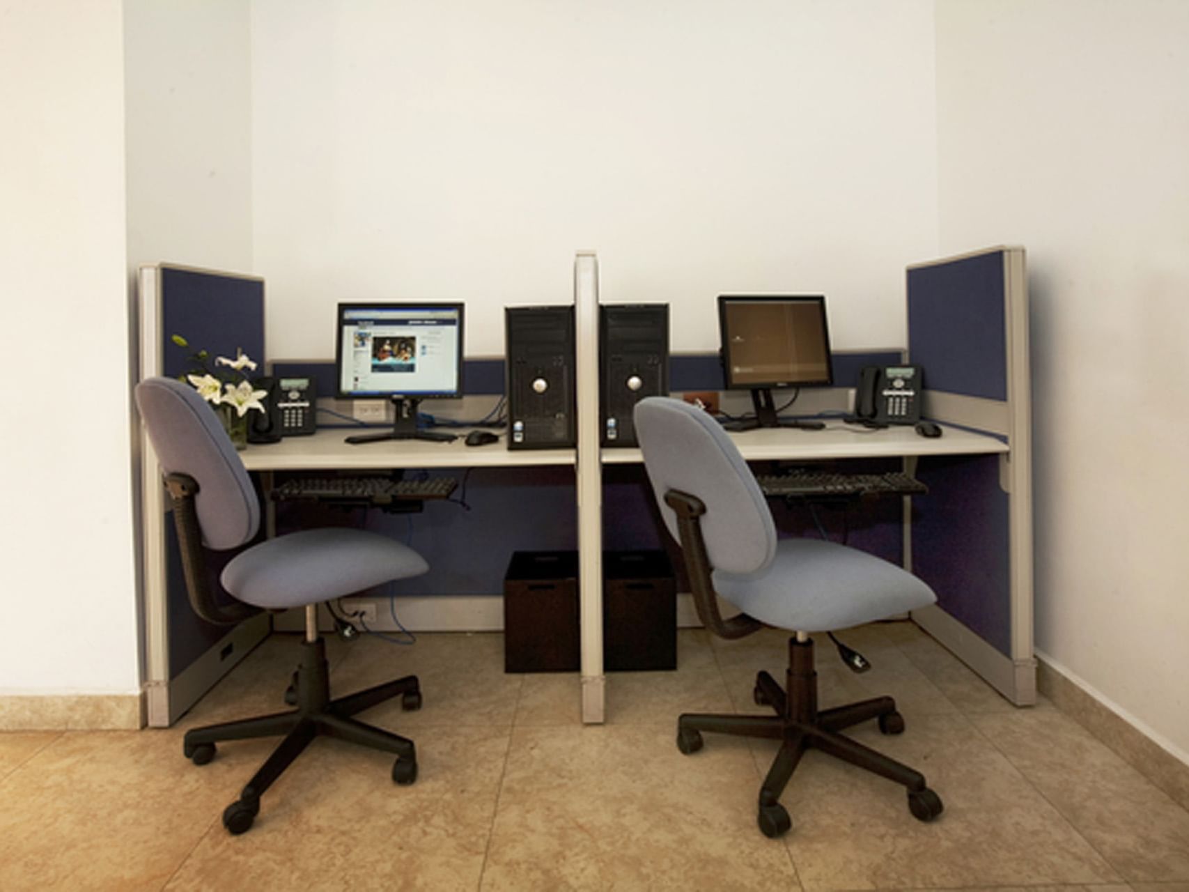 Separated workstations in a business center at One Hotels