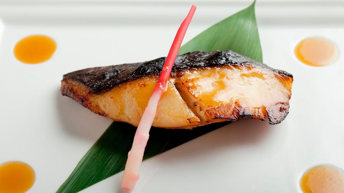 Seared fish fillet on a green leaf served in Nobu Restaurant at Crown Hotel Melbourne