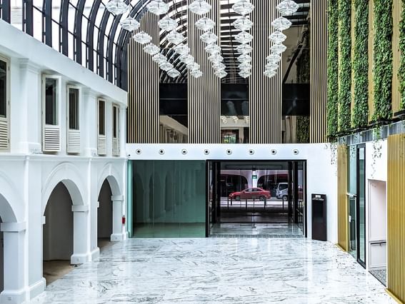 Atrium area between entrance and lobby of Park Hotel Group