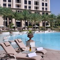 Sun loungers by the pool at Palazzo Versace Dubai