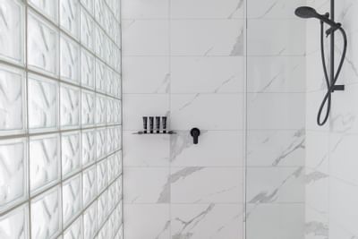 Shower in a bathroom at Brady Hotels Jones Lane