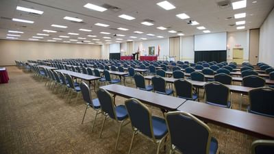 Classroom-style chairs set up in a hall at Music Road Resort