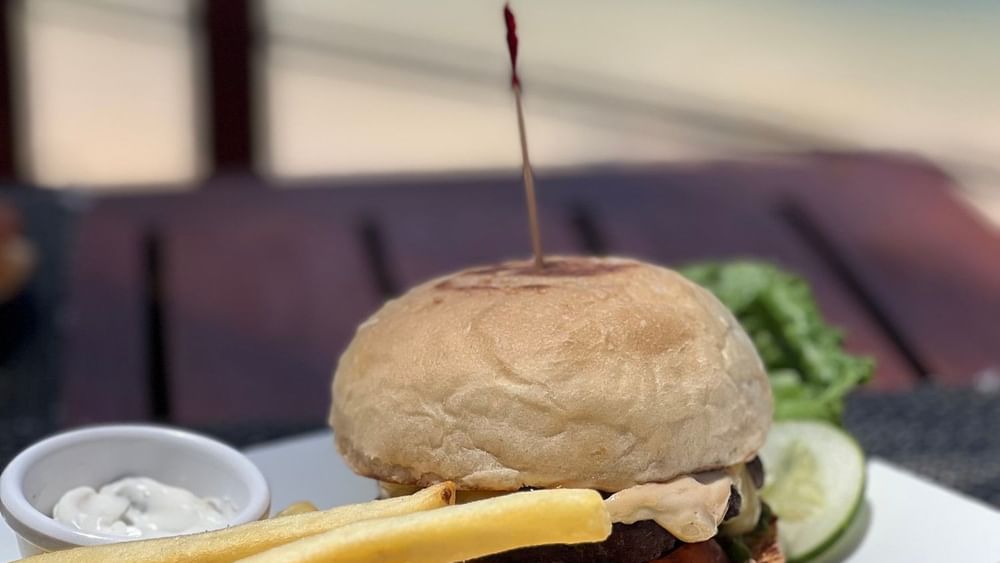 Burger with fries and side salad at Grill & Pool Bar, Warwick Fiji Resort and Spa, Korolevu.