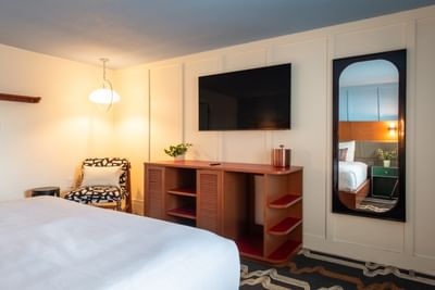 Hotel guest room with bed and television at Driftaway Hotel and Pool