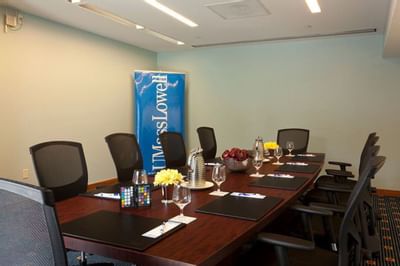 Conference table setup for a meeting at UMass Lowell Inn