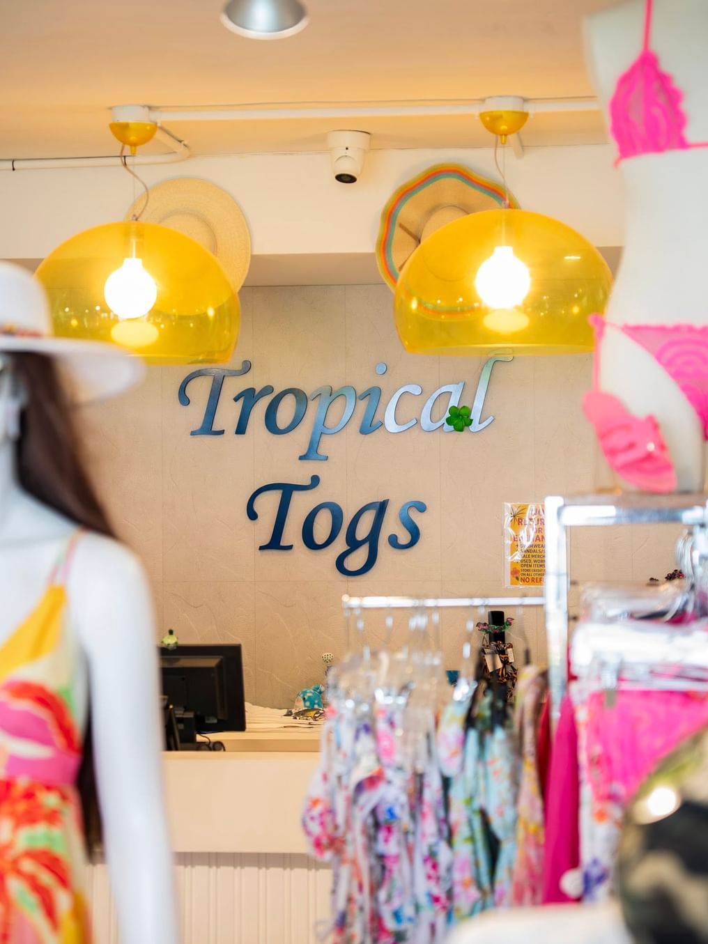 Tropical togs sign with bikinis
