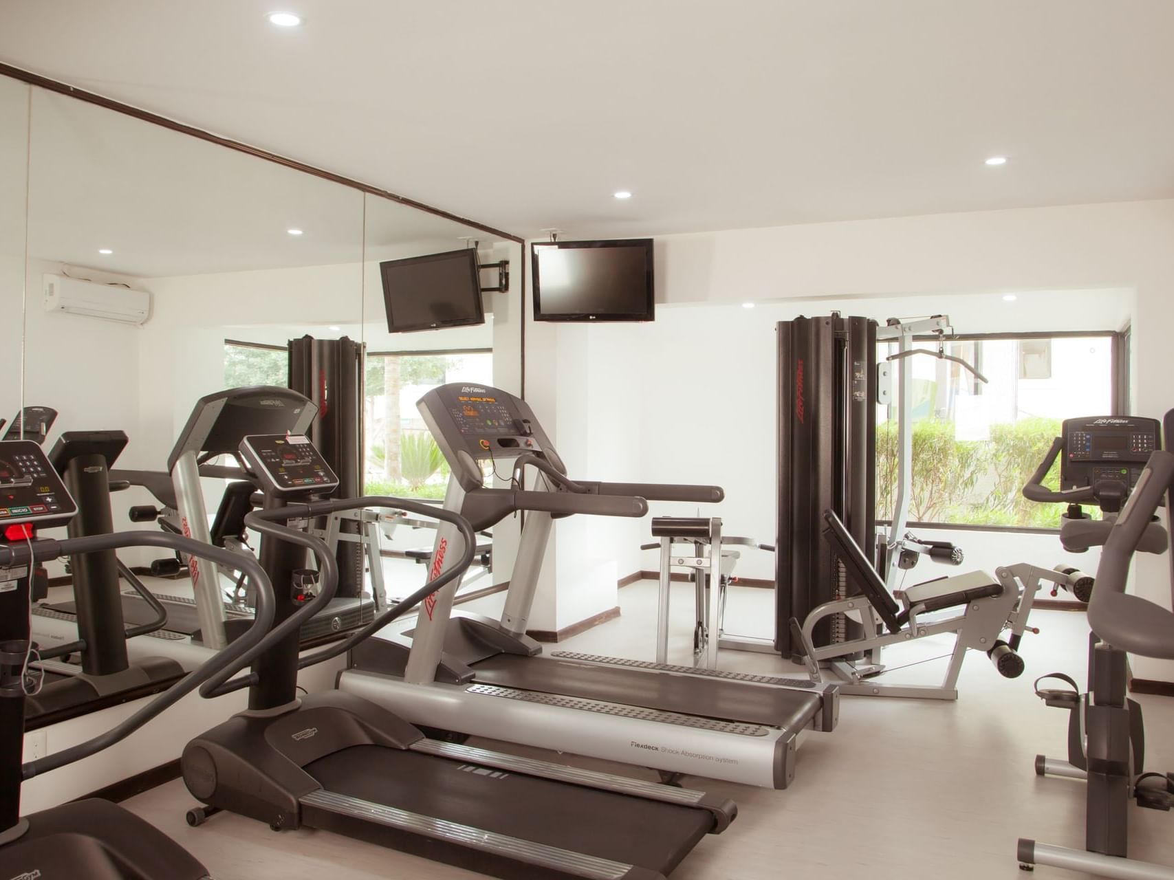 Exercise machines in a Gym Wellness Center at Fiesta Inn Hotels