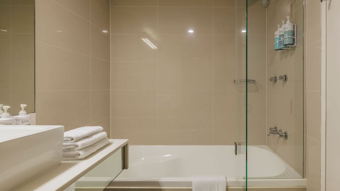 Bathroom with vanity and bathtub in Balcony Room at Novotel Sydney Olympic Park