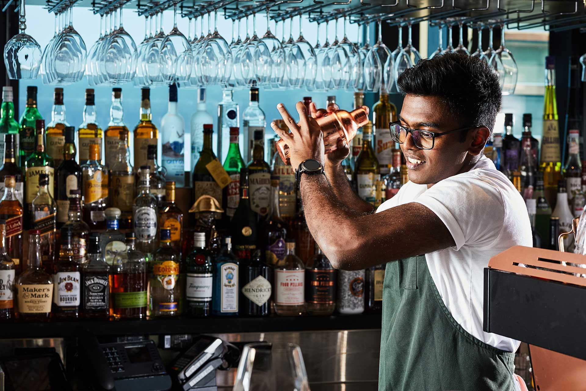 A bartender making drinks at Melbourne Central Hotels