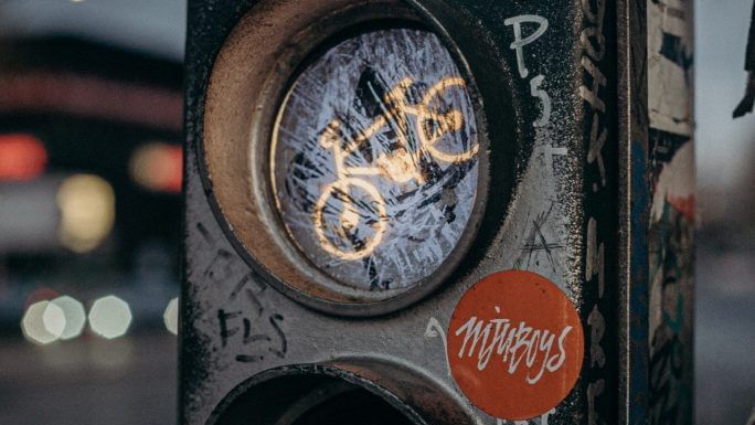 Close-up of street art on traffic lights near Hotel Berlin