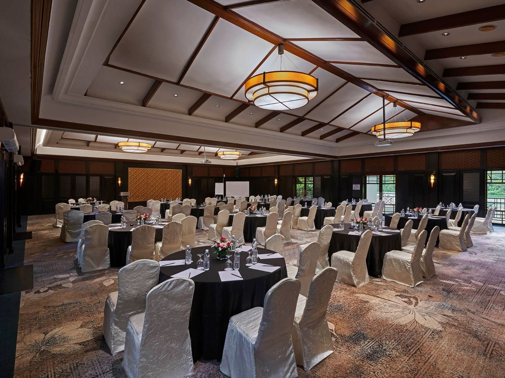 Banquet tables arranged in Zamrud event room with carpeted floors at Saujana Hotel Kuala Lumpur