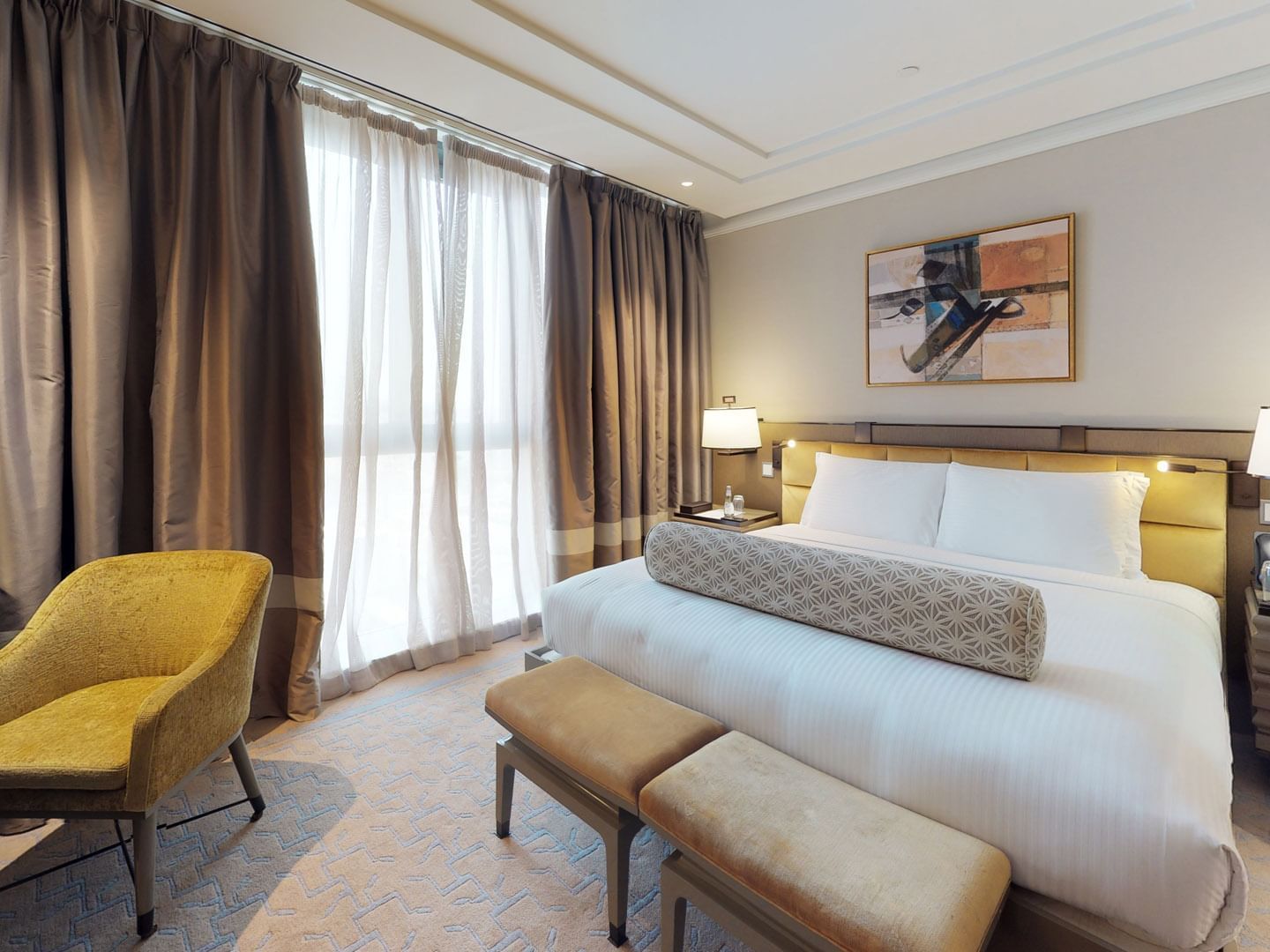 Interior of Divine suite with King size bed at Hotel Galleria