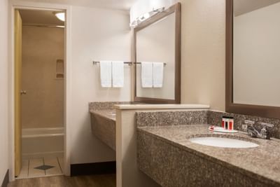 Vanity area of the bathroom in King Studio Suite at Hotel Bo