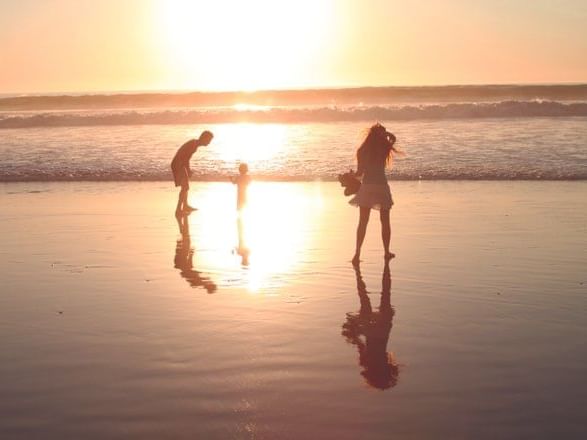 Family of 3 on the beach in sunset, Inn by the Sea at La Jolla