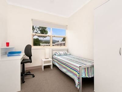 Student Living – Magill Apartments with Bedroom with study desk and wardrobe