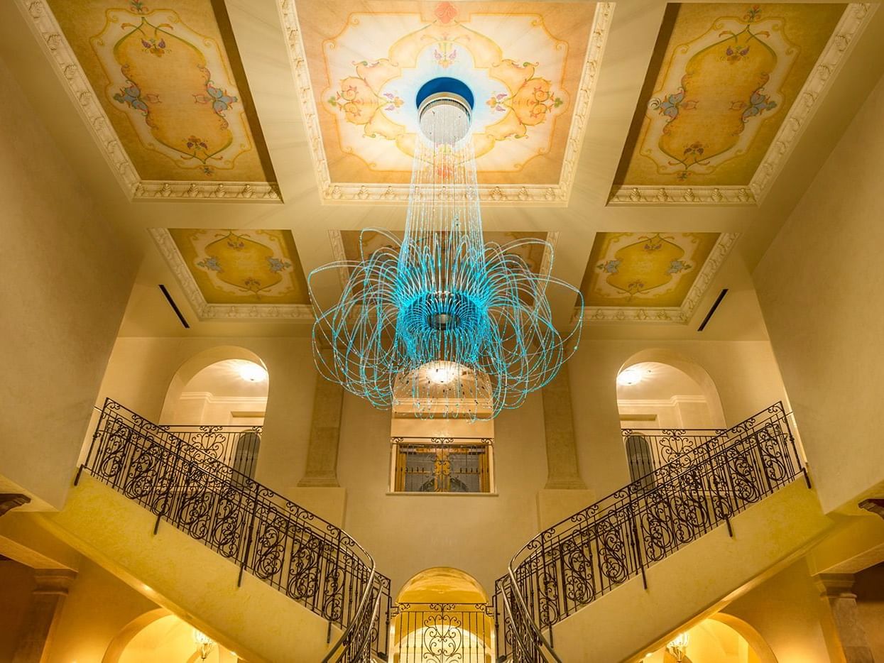 Chandelier above staircase in Allegretto Vineyard Resort lobby