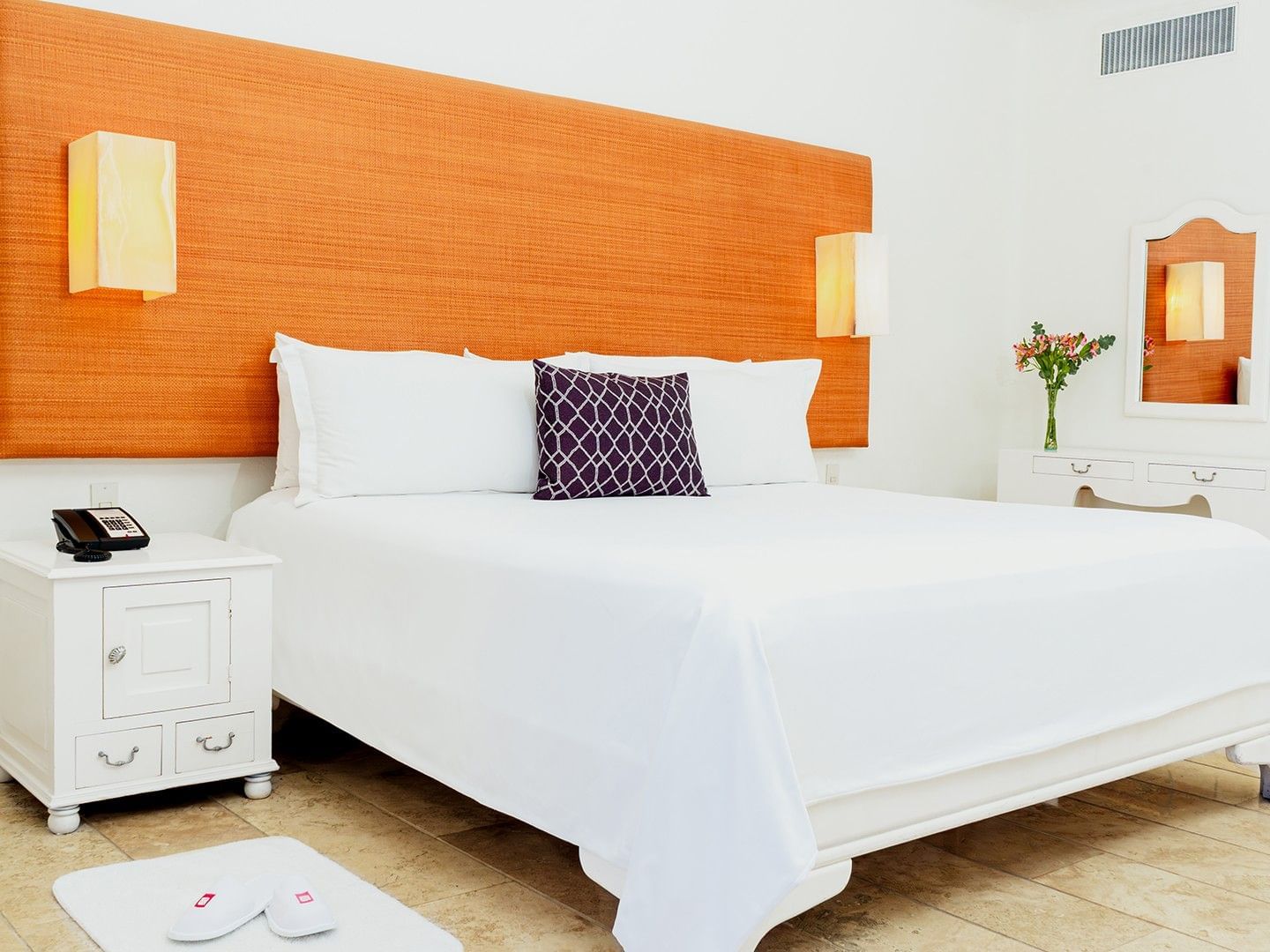 Nightstand and dresser by the cozy bed in King Suite Private Pool with wooden floors at Camino Real Zaashila Huatulco