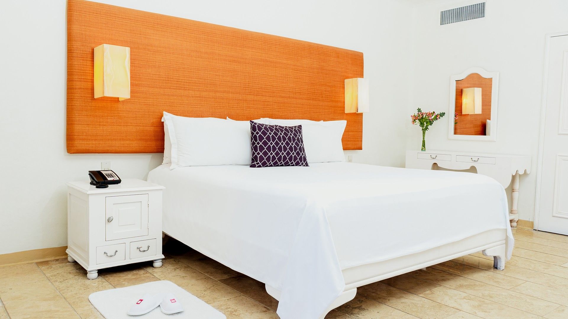 Nightstand and dresser by the cozy bed in King Suite Private Pool with wooden floors at Camino Real Zaashila Huatulco