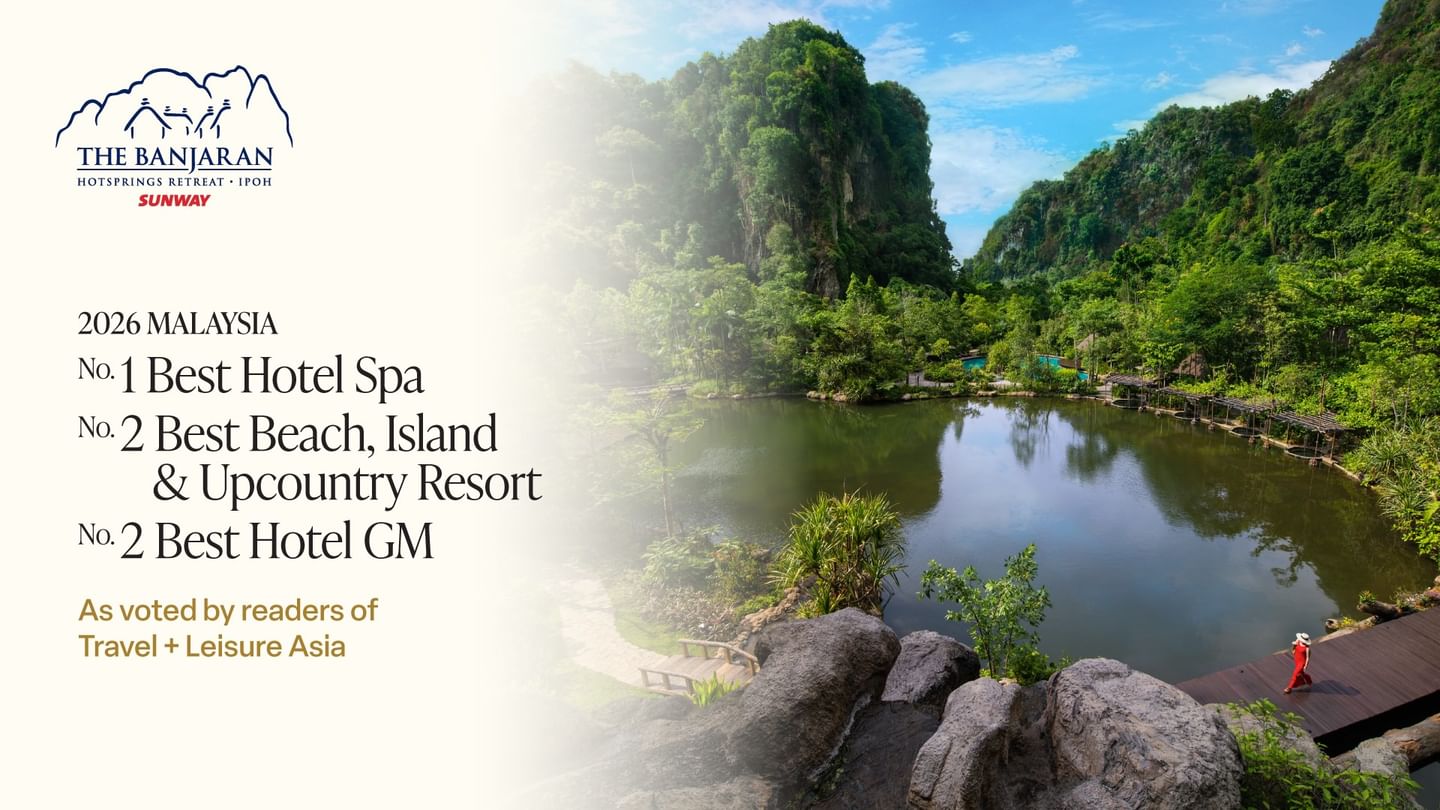 Aerial view of a hot spring surrounded by lush limestone cliffs and tropical greenery at a luxury resort spa destination, The Banjaran Hotsprings Retreat