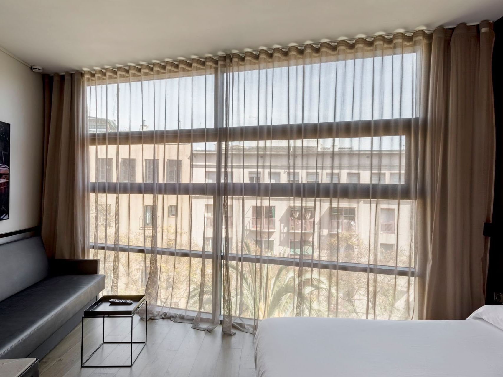 Bedroom with a city view in a room at Aparthotel Allada