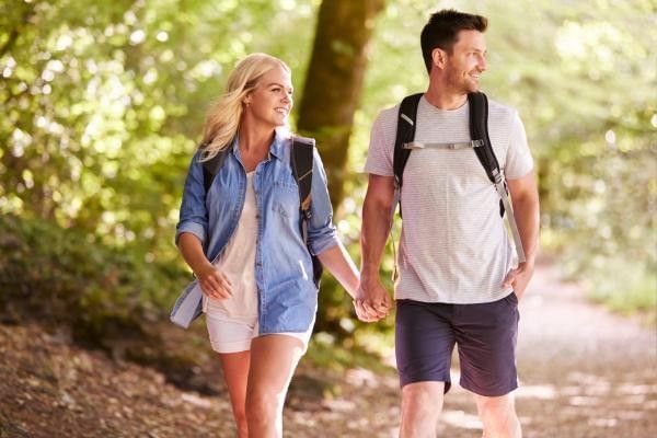 Couple exploring Devil's Punch Bowl, one of the best free places to visit in Surrey