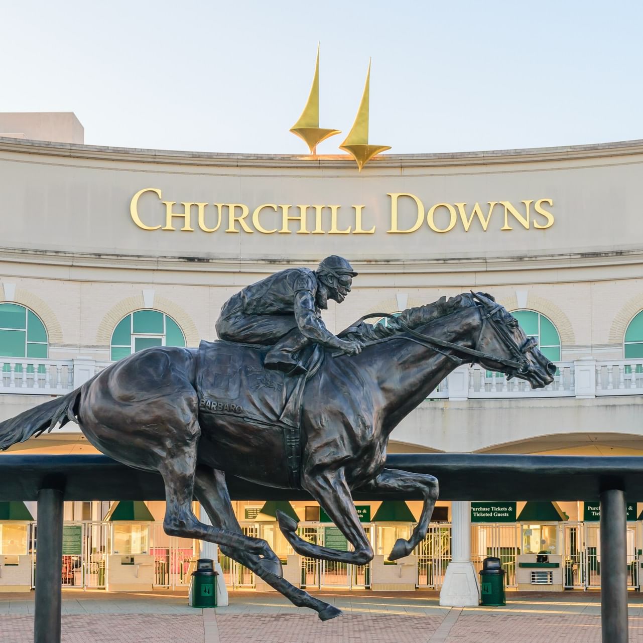 Bronze Barbaro horse and jockey statue in front of Churchill Downs entrance near Cottonwood Louisville