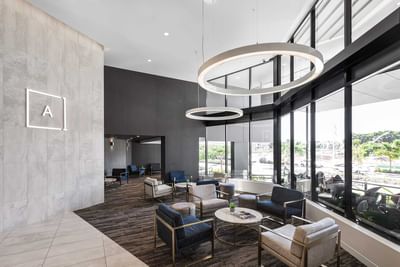 Lobby lounge area with arranged seating and carpeted floors at Alcyone Hotel Residences