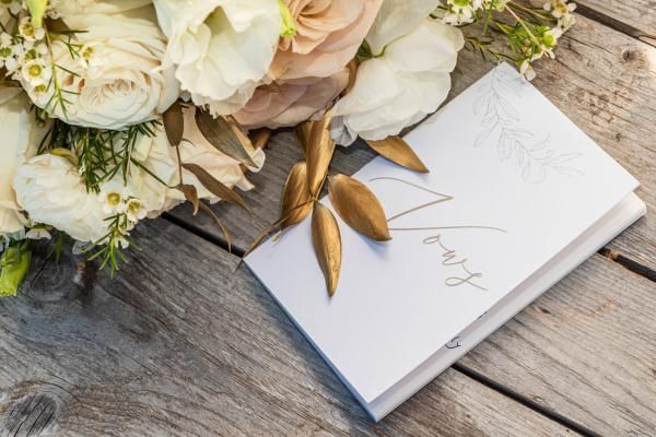 Copy of vows which is another essential to put in wedding day emergency kit for the bride