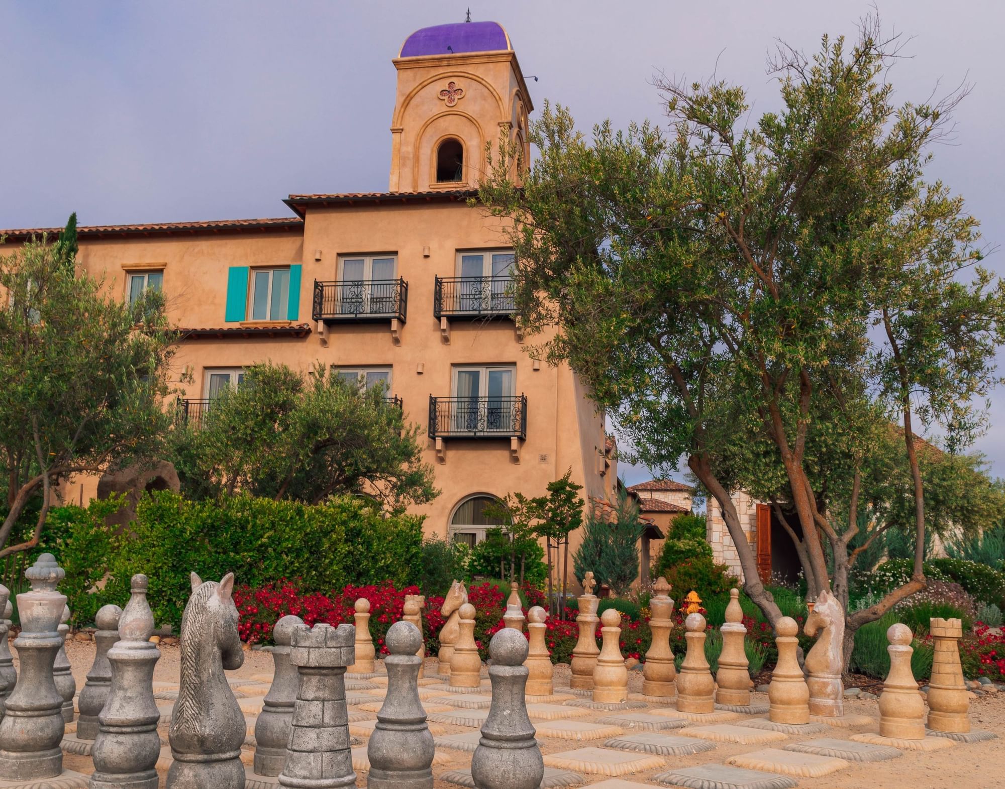 Lorem ipsum Giant chess pieces and board set up in front of bulding