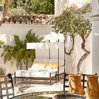 Outdoor lounge & dining in Maria Luisa at Marbella Club