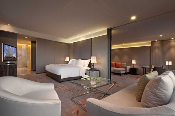 Prestige club Bedroom with a king bed at Okura Prestige Bangkok