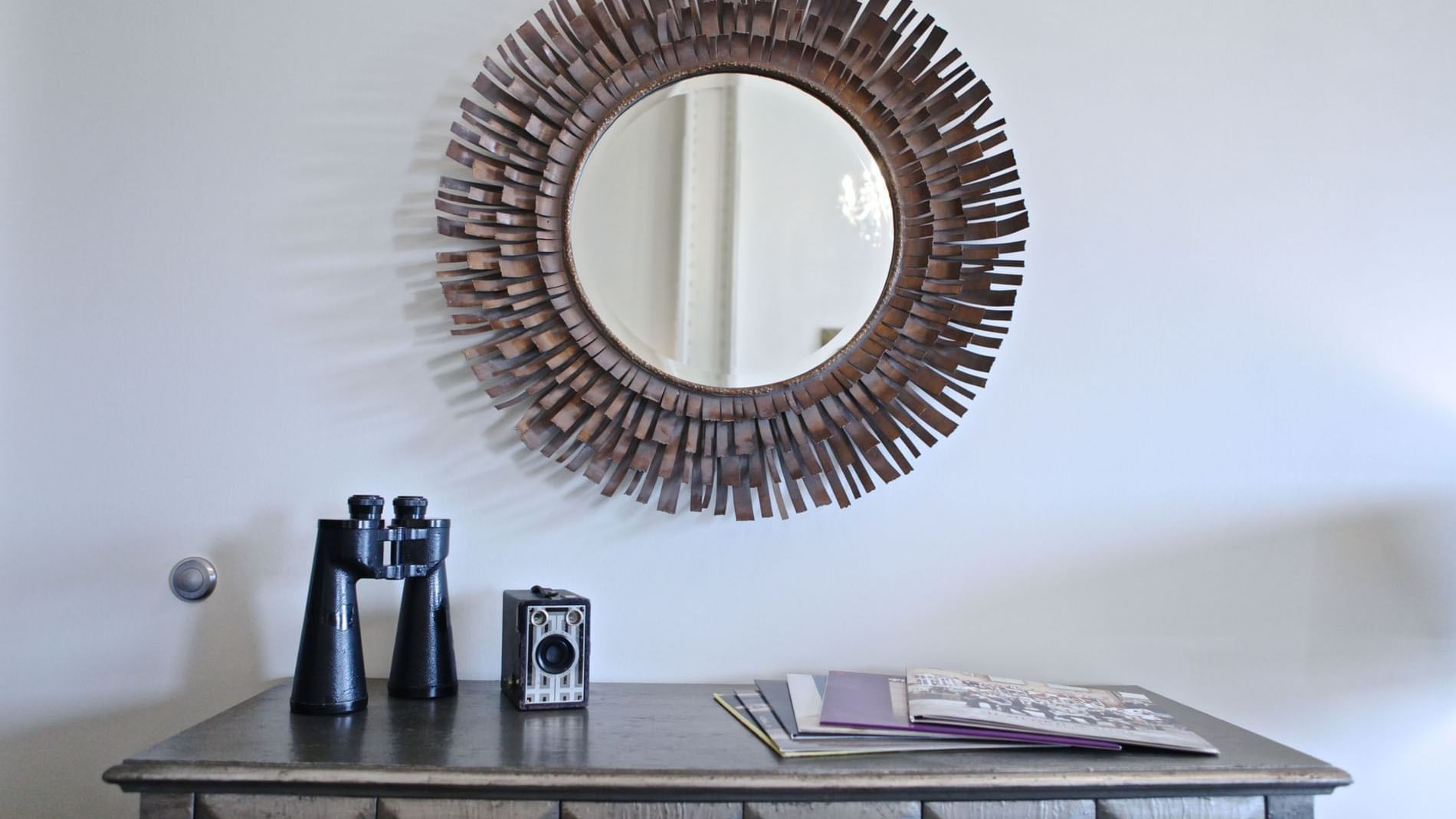 Mirror decor on wall in Penthouse Unit S at The Mayo Hotel